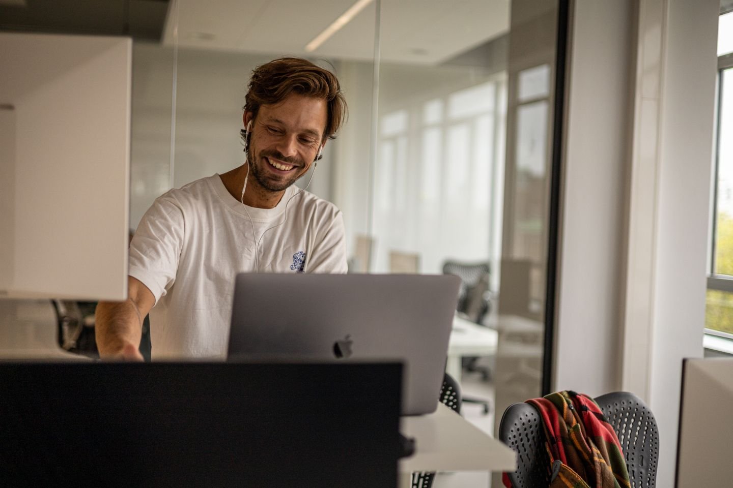 Photo of a Humanoid behind a laptop