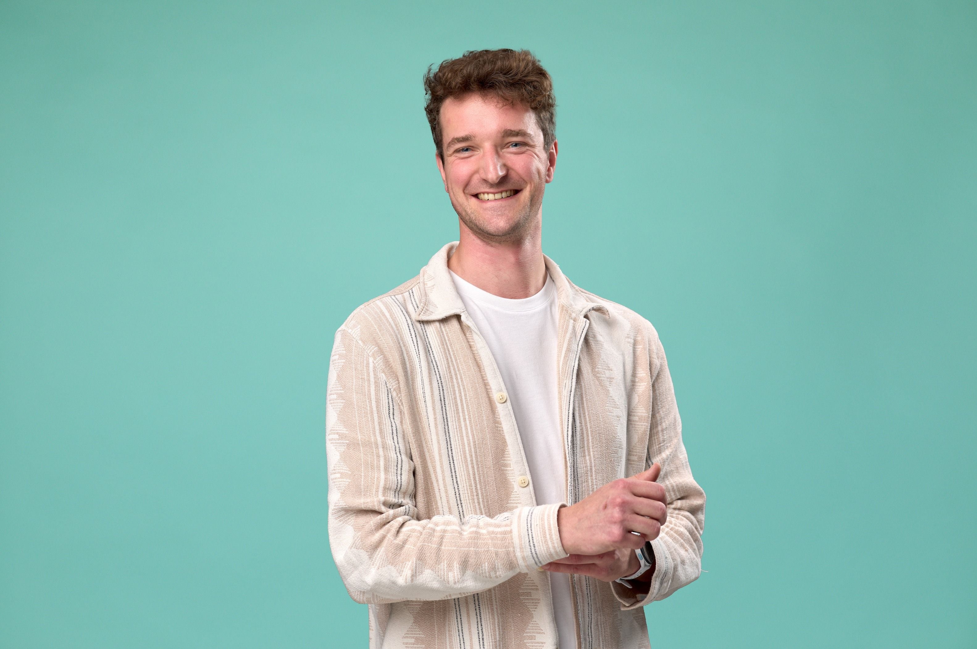 Picture of Thomas with a blue background